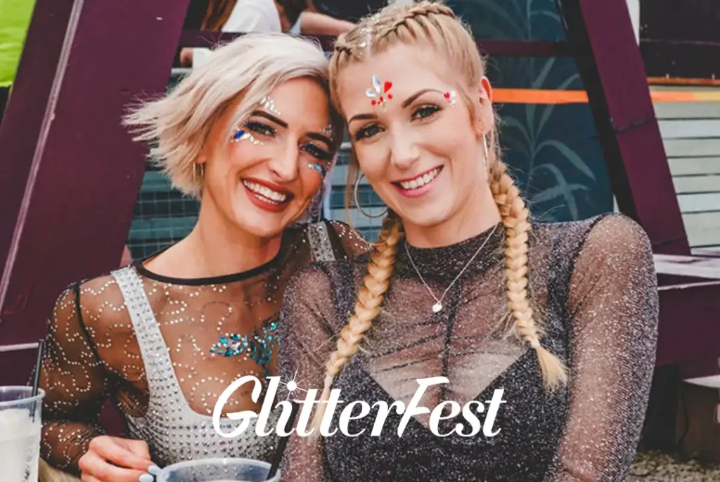 Glitterfest Leeds - Two women wearing sparkly outfits and glitter makeup at Glitterfest